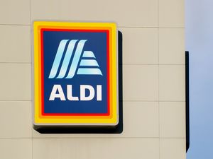 Aldi store logo mounted on a wall