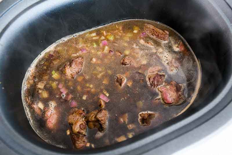 Beef, Guinness, broth, root vegetables, thyme and salt Mixed together in slow cooker 