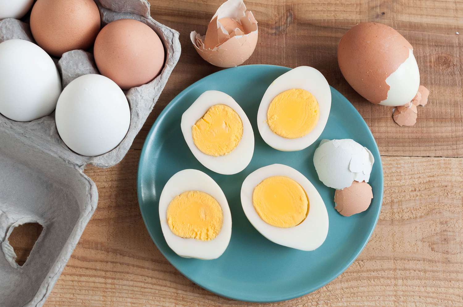 Hard-boiled eggs sliced in half and placed in a blue plate