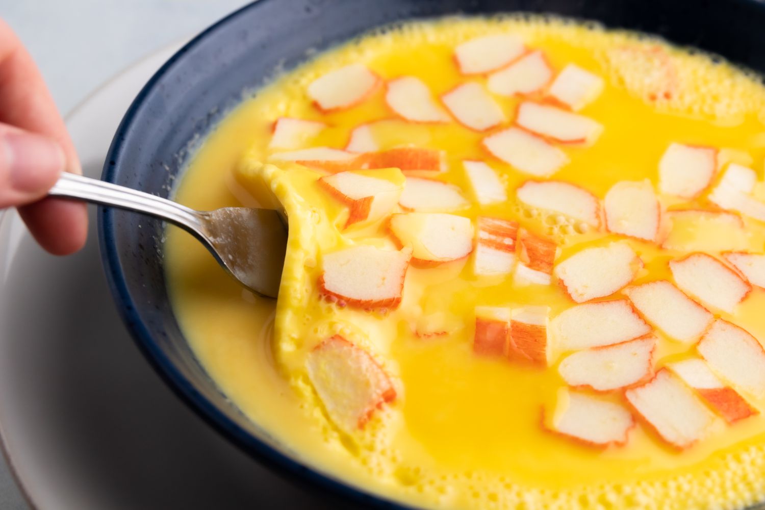 Scrape the sides and bottom of bowl with a fork.