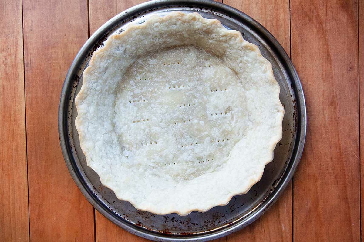 Old Fashioned Chess Pie crust par-baked and set on a platter.