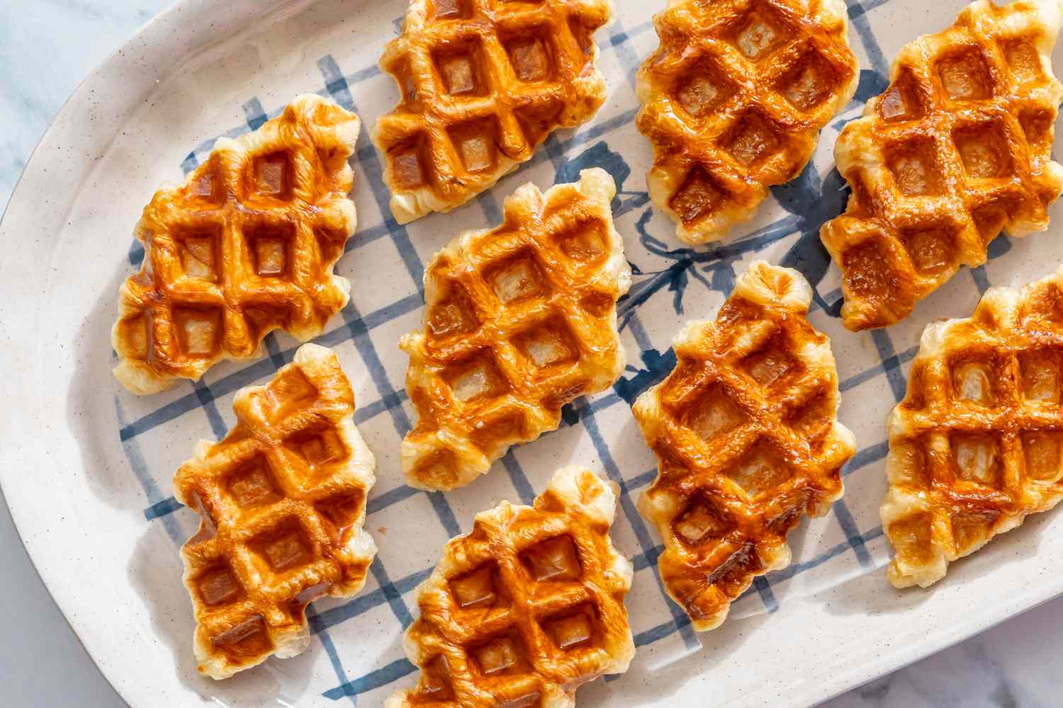 A plate of croffles arranged neatly