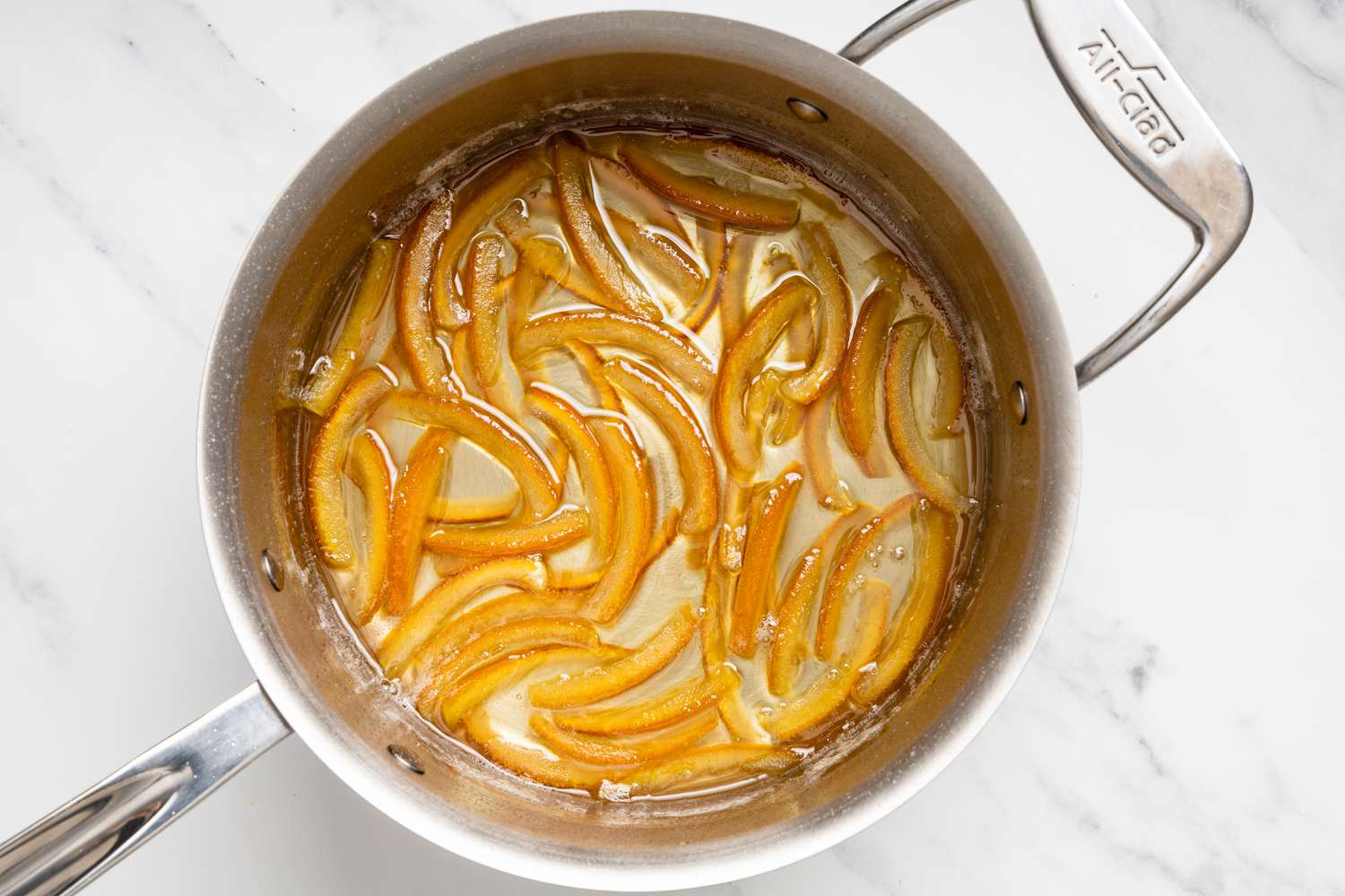 Orange Peels in Pot of Reduced Simple Syrup for Chocolate Covered Orange Peels Recipe