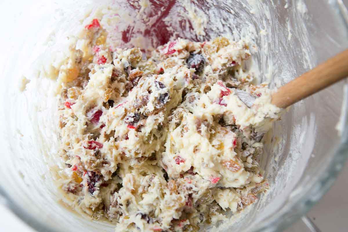 Stir the dried fruits into the batter for the fruitcake recipe
