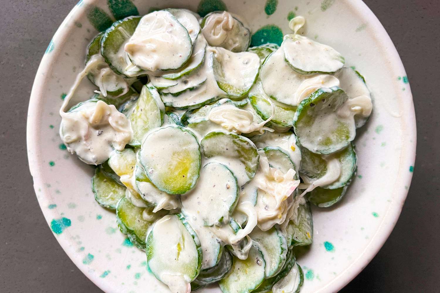 cucumber salad in mayo dressing in a bowl