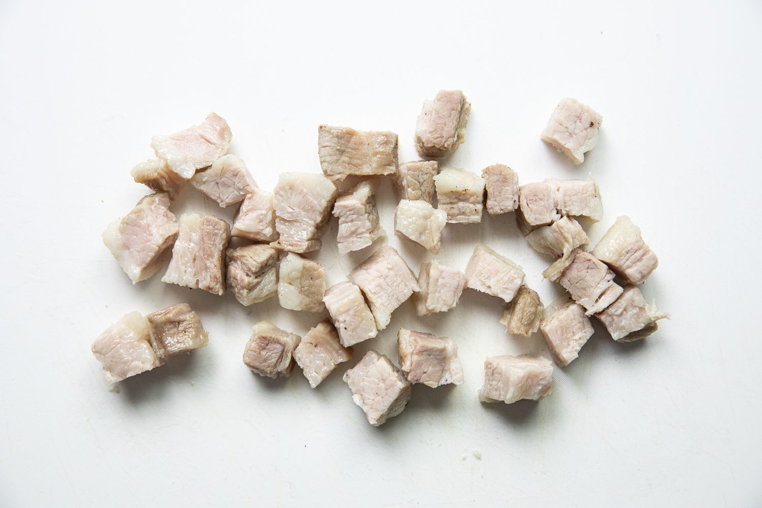 Cubes of Pork on the Counter for Filipino Rice Noodles Recipe