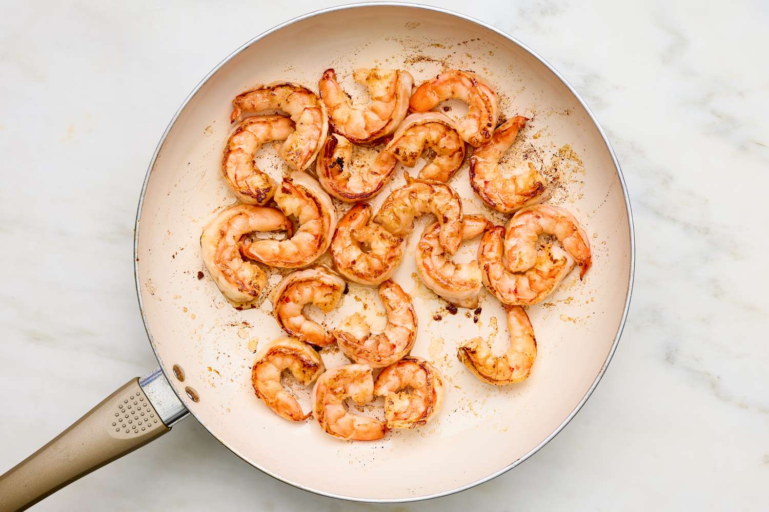 Shrimp cooked ina skillet for Creamy Skillet Shrimp with Corn, Pancetta, and Tomatoes recipe