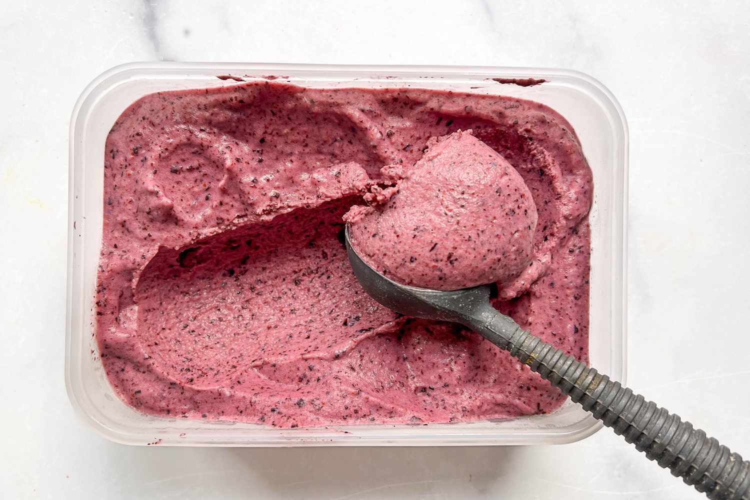 Frozen yogurt in a clear tub