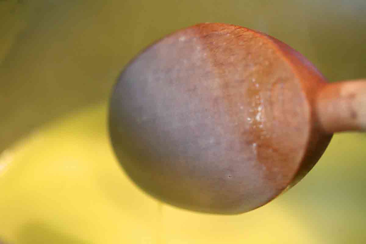 Wooden spoon with custard coating 