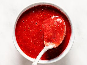Raspberry-Soy Sauce in a small bowl with a spoon