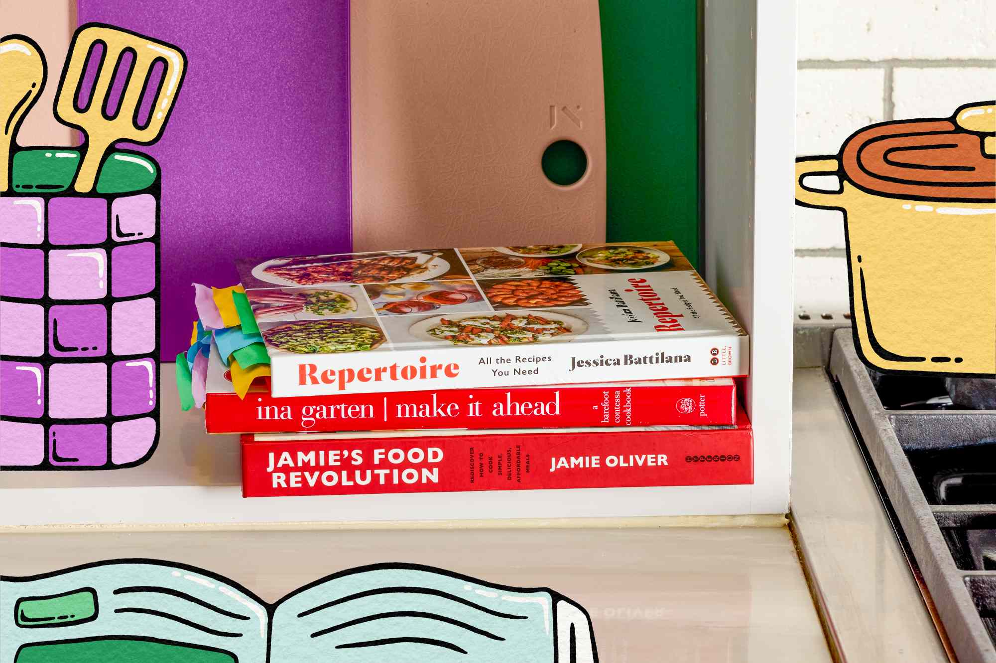 Stack of cookbooks on a shelf including titles by Jessica Battilana Ina Garten and Jamie Oliver