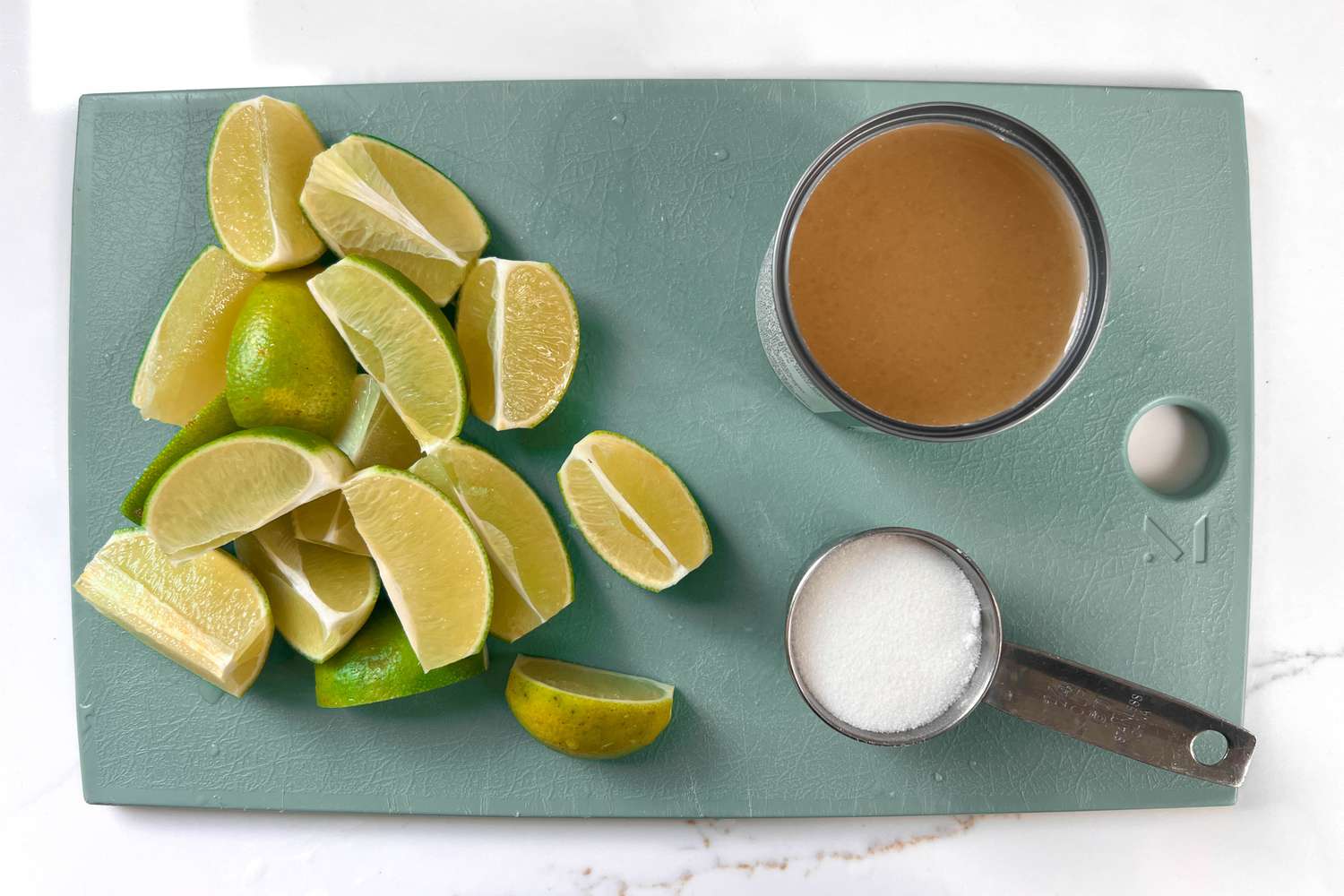 quartered limes, sweetened condensed milk, sugar