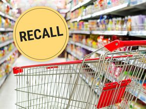 Shopping cart in a supermarket aisle with a RECALL sign superimposed