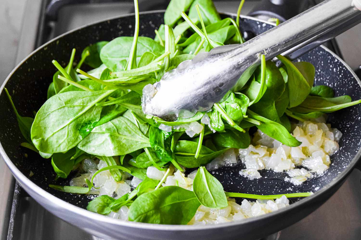 Spinach Added to Onions in Pan for Easy Frittata Recipe
