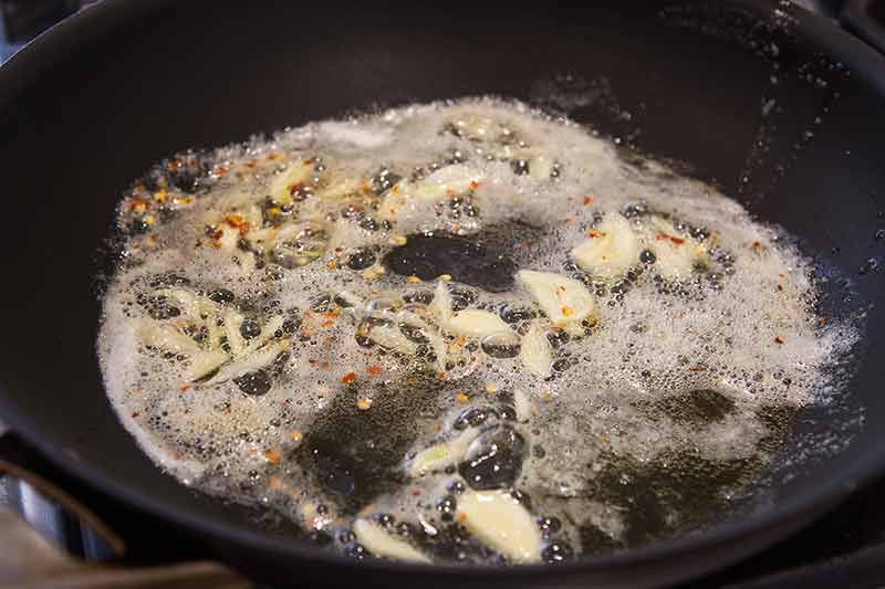 Sautéd garlic and red pepper flakes in butter and olive oil for Scampi Sauce