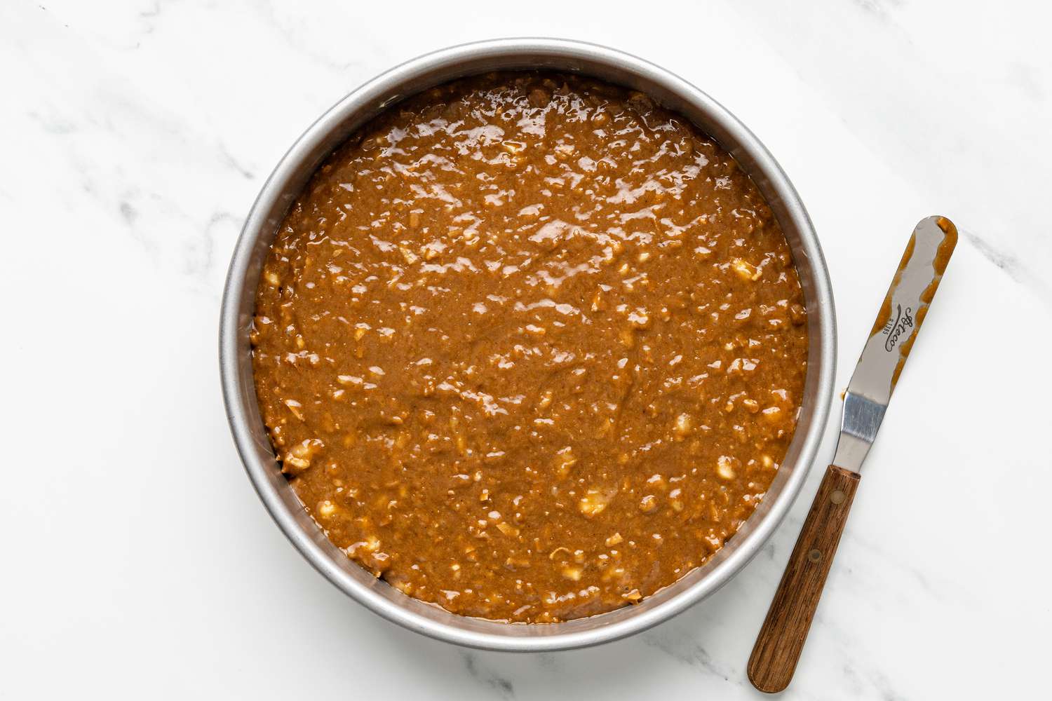 Coffee Coconut Banana Bread Cake Recipe Batter Added to Lined Circular Cake Pan 
