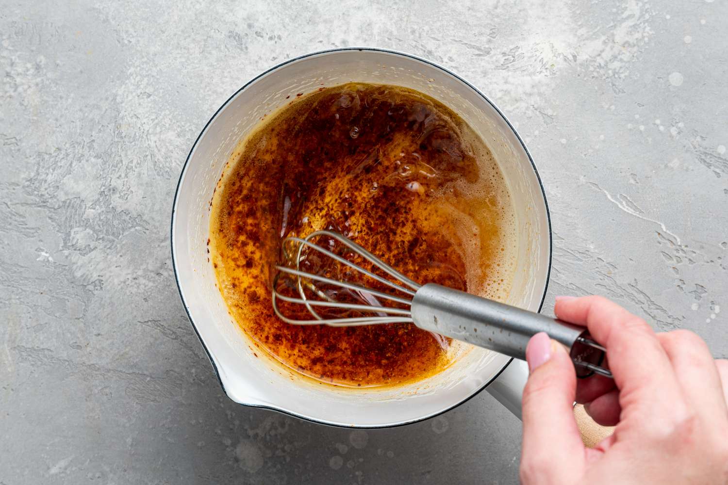 Pul Biber Butter Topping Whisked Together in Small Sauce Pan