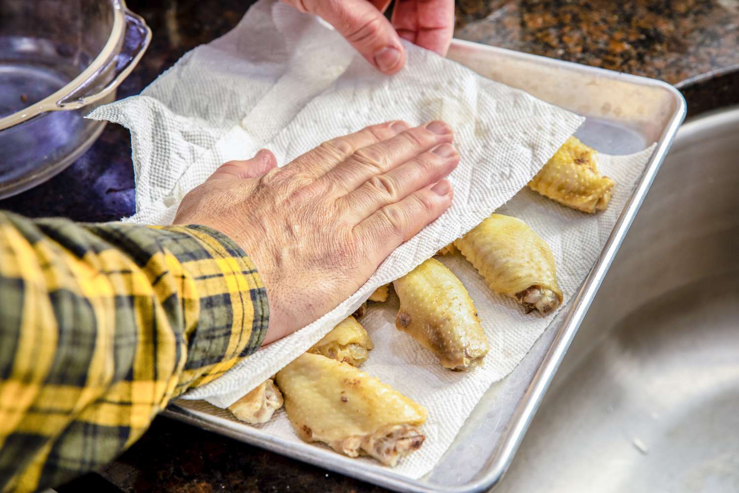 Cooked Wings on a Paper Towel Lined Baking Pan and Patted Dry Using More Paper Towels for Microwave BBQ Wings Recipe 