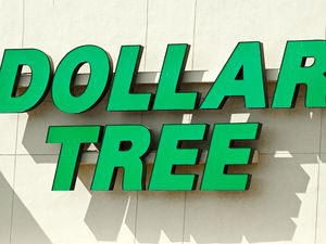 Dollar Tree storefront sign on a beige wall