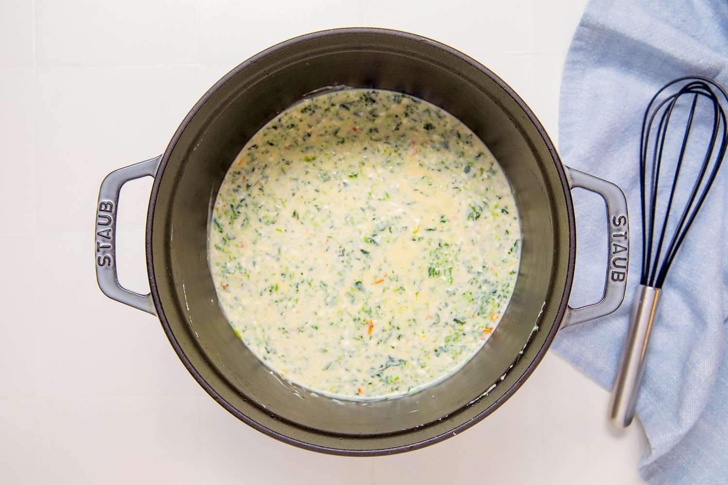 Overhead view of sauce in a saucepan before adding to the casserole dish for Marry Me Chicken Casserole recipe