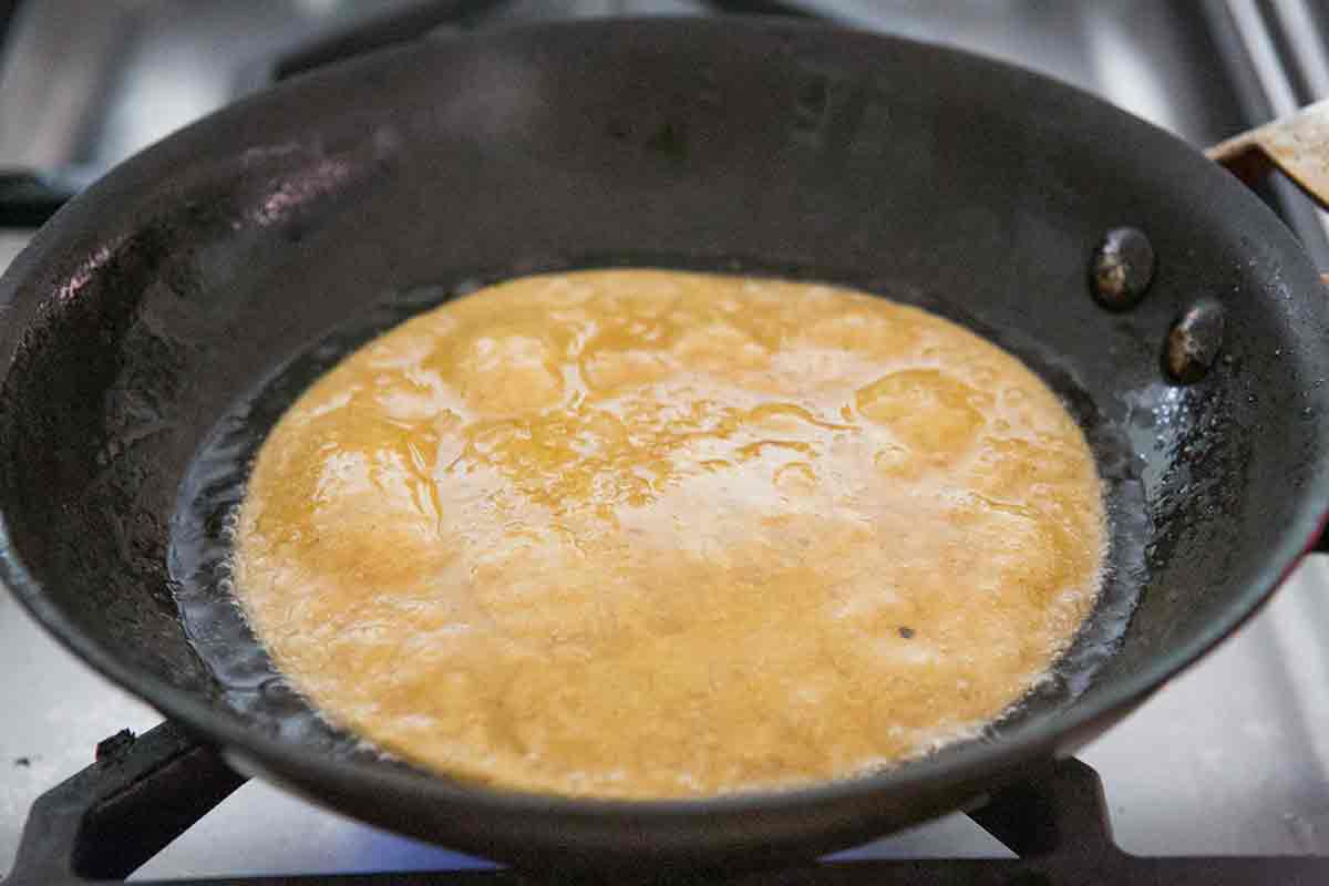Soften the tortillas in a little oil in a skillet