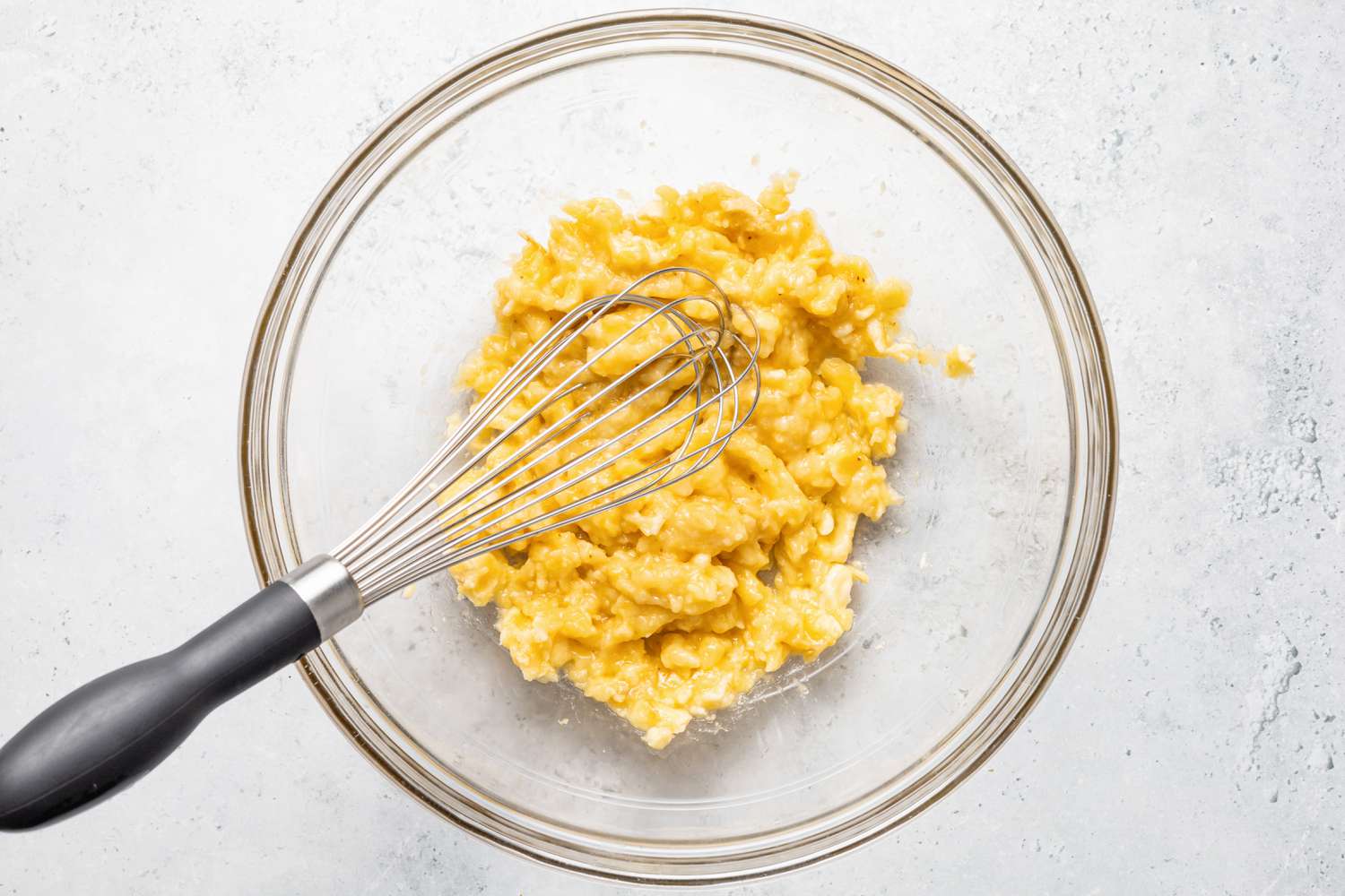 Whisk Used to Mashed Bananas in a Bowl for Brownie Banana Bread