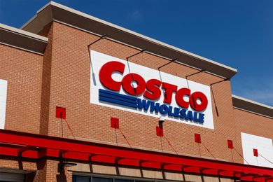 Costco Wholesale storefront sign on a brick building