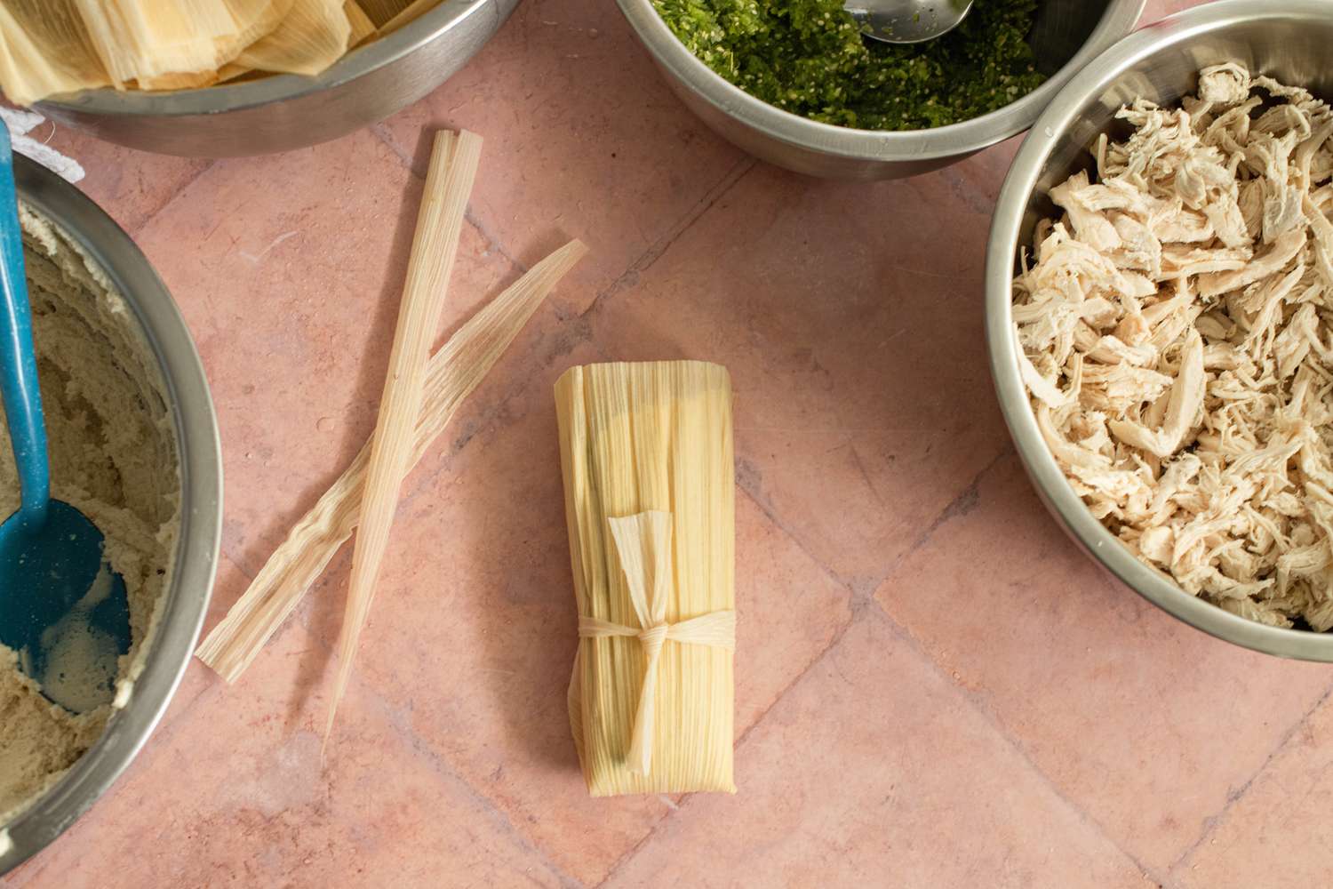 Making the Tamales: Tamales Secured by Tying a Strip of Corn Husk 