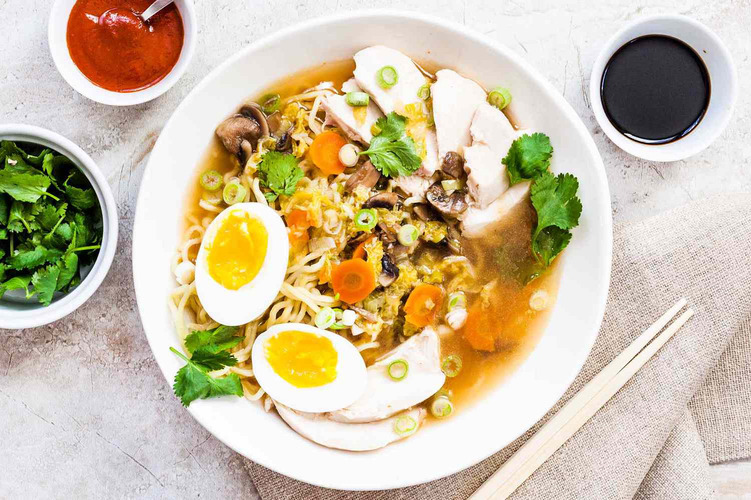 Easy Chicken Ramen Recipe in a bowl with garnishes