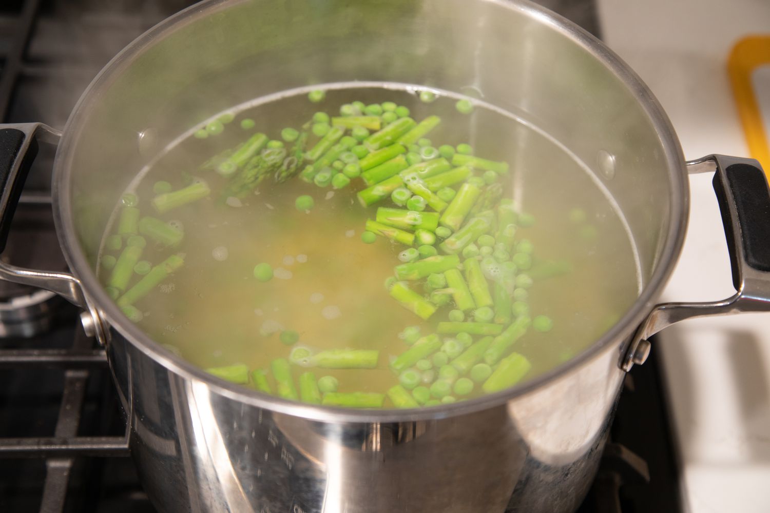 Boil Pasta and Vegetables in Pot over Stove for Green Goddess Pasta Salad 