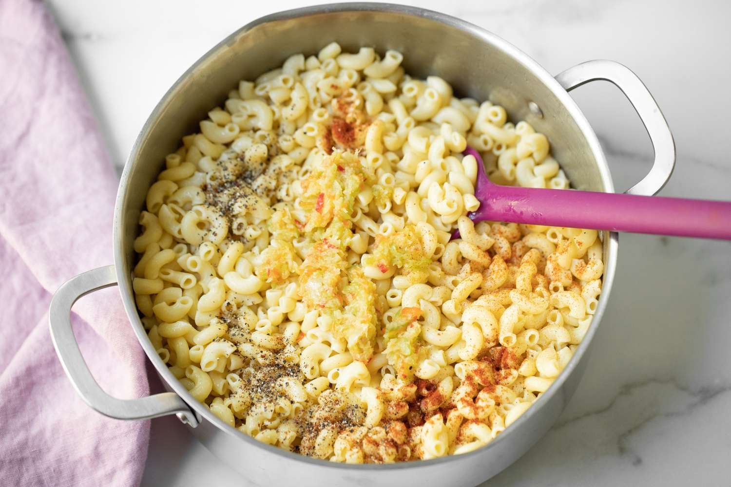 Spices and Aromatics Added Trinidadian Macaroni Pie Pasta in a Pot and Mixed Together Using a Spatula