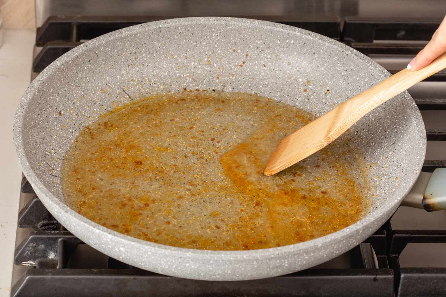 Deglazing skillet to make sauce for pork schnitzel.