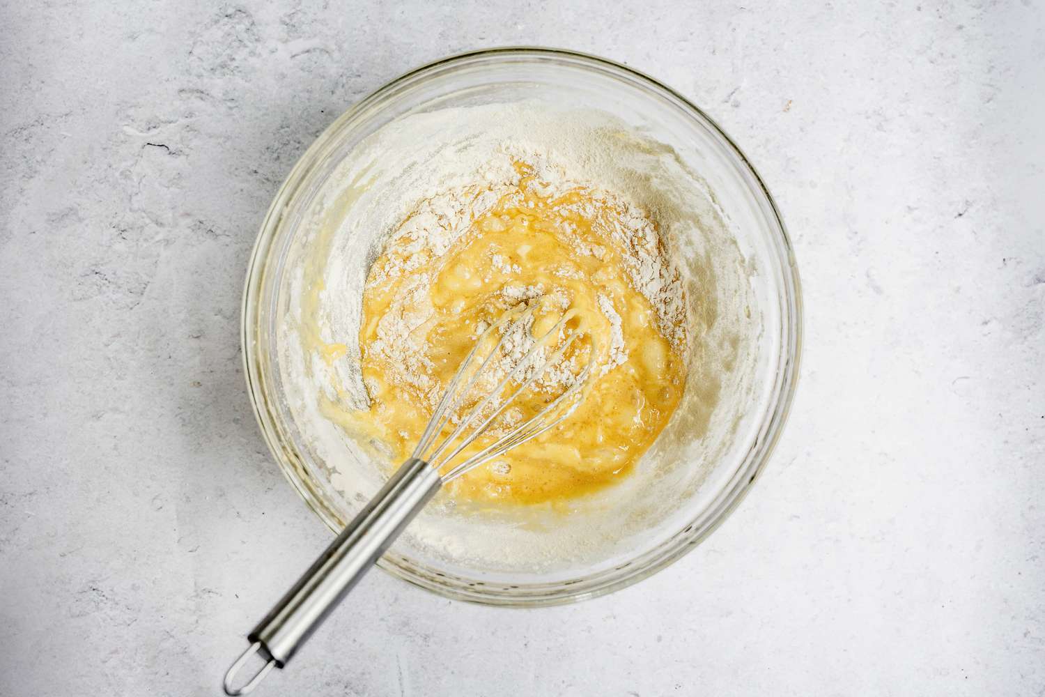 Whisk flour and milk into the batter.