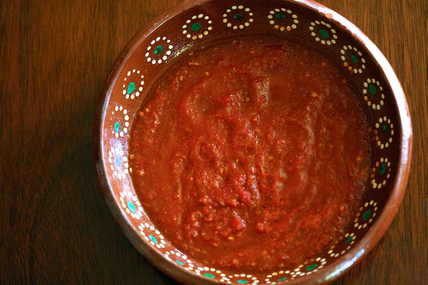 A bowl of cooked tomato salsa, ready to serve