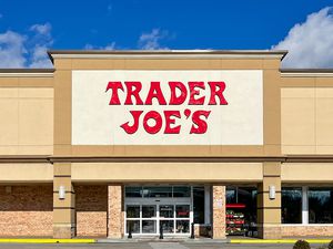 The storefront of Trader Joe's with its recognizable red-lettered sign