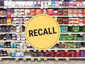 Grocery store coffee aisle with a yellow Recall sign overlay