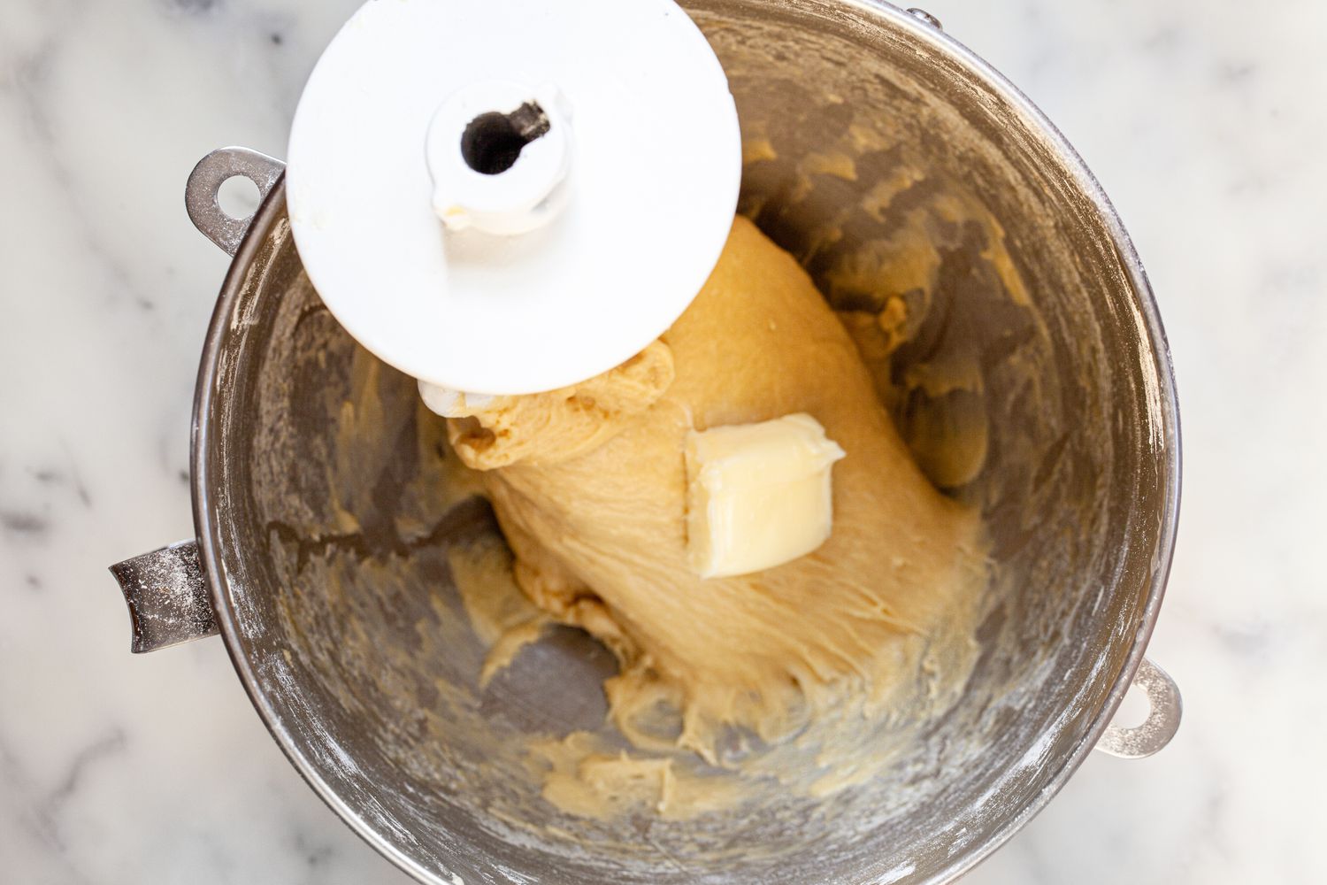 Slabs of Butter Added to Brioche Sandwich Loaf Dough While Mixed in a Mixer Bowl with the Dough Hook Attachment