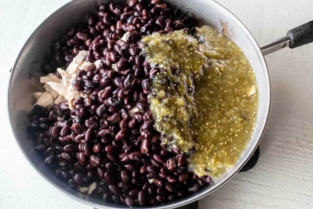Cook chicken beans and salsa in pan for freezer burrito fillings