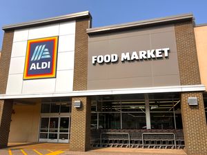 Aldi storefront with a large sign displaying Food Market above the entrance