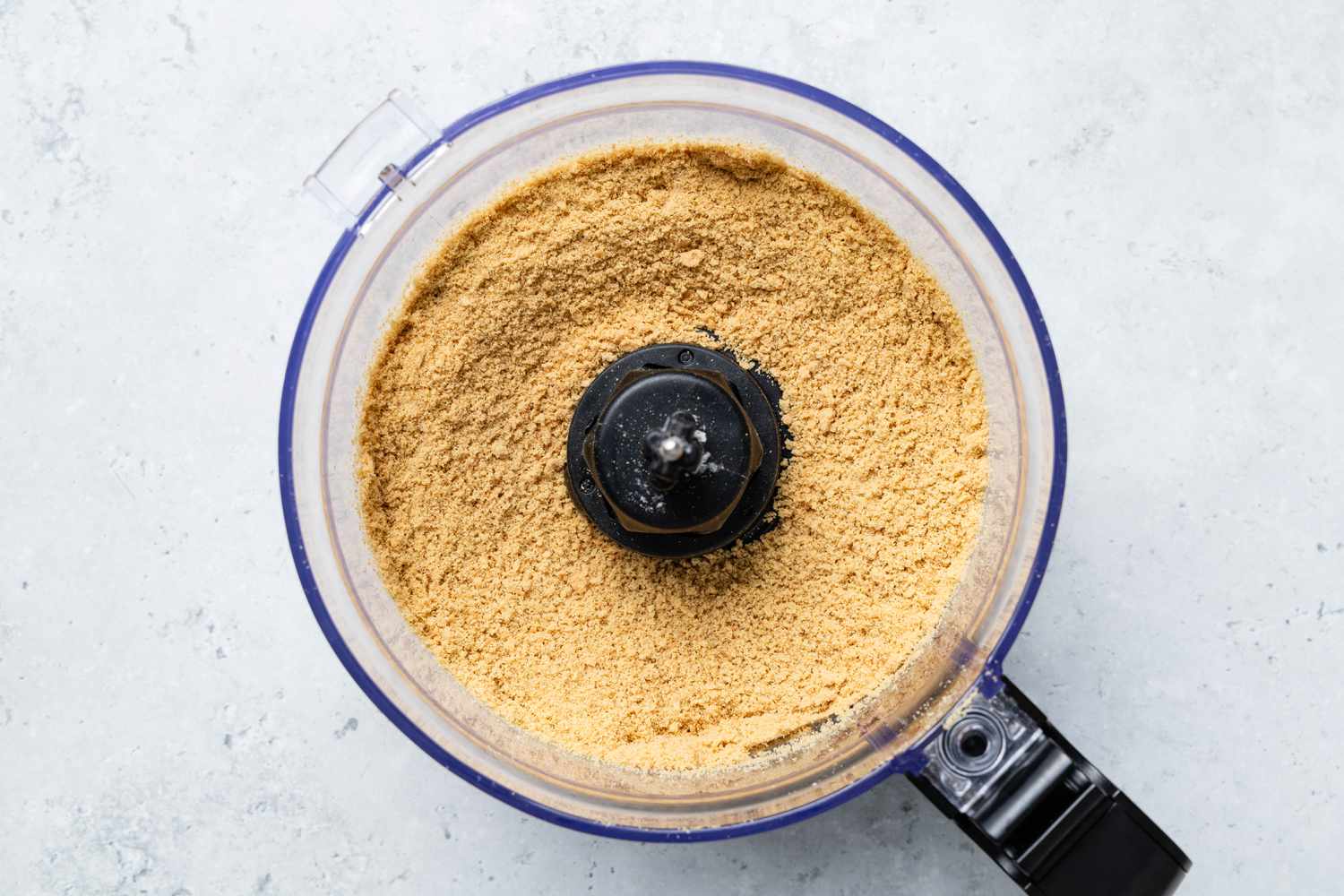 Graham Cracker Crumbs in a Food Processor for Million Dollar Pie Recipe