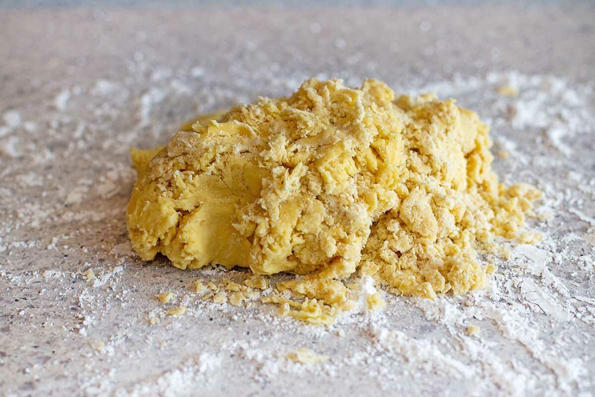 Dough for Butterhorn Christmas Cookies dumped on a floured counter.