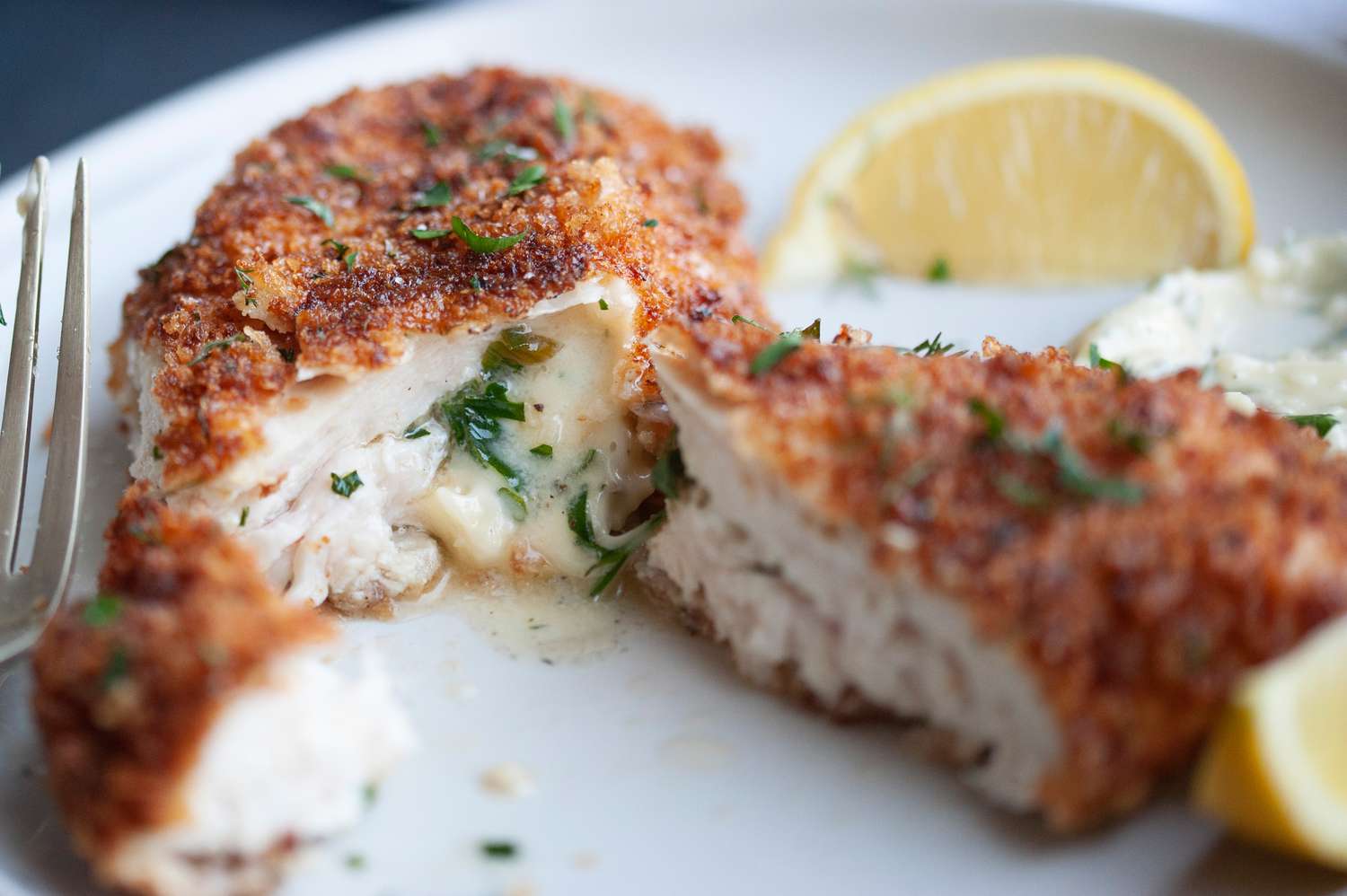 Butter oozing out of Chicken Kiev. 