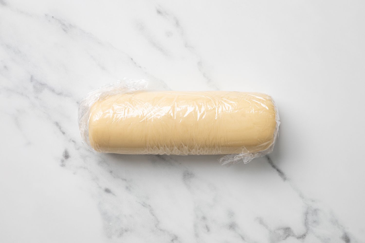Log of Marzipan Wrapped in Plastic Wrap