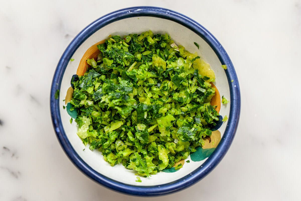 Greens added to the top of osso bucco.