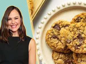 Caroline Campbell smiling next to a plate of cookies