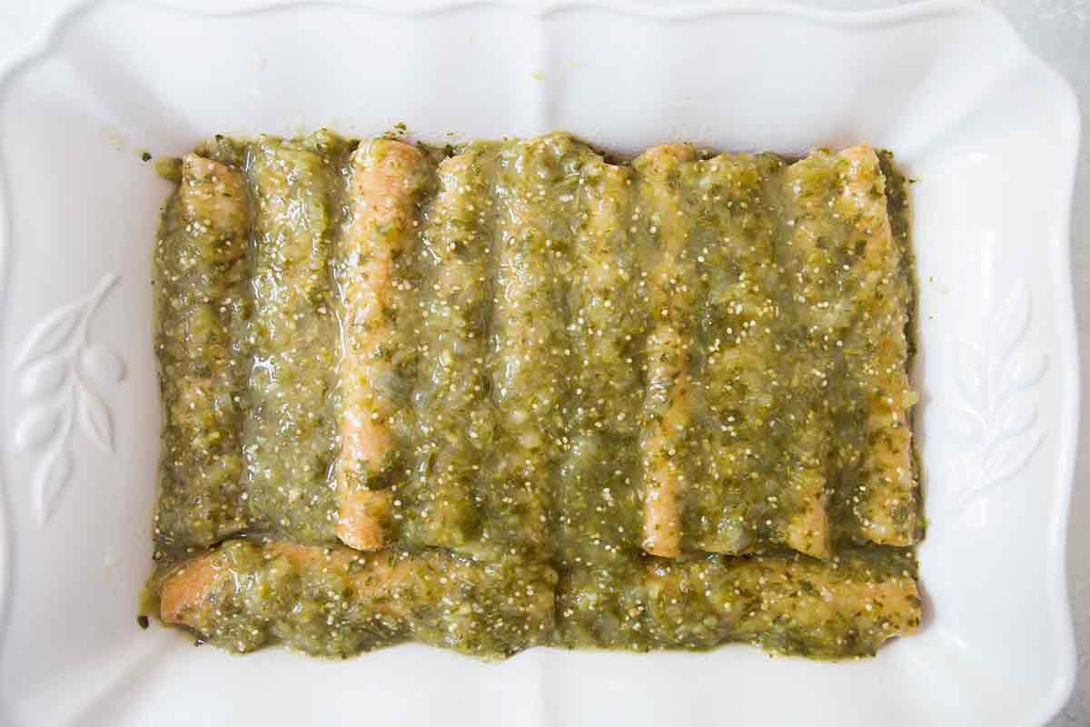 Enchiladas Verdes in Serving Pan covered in Green Sauce 