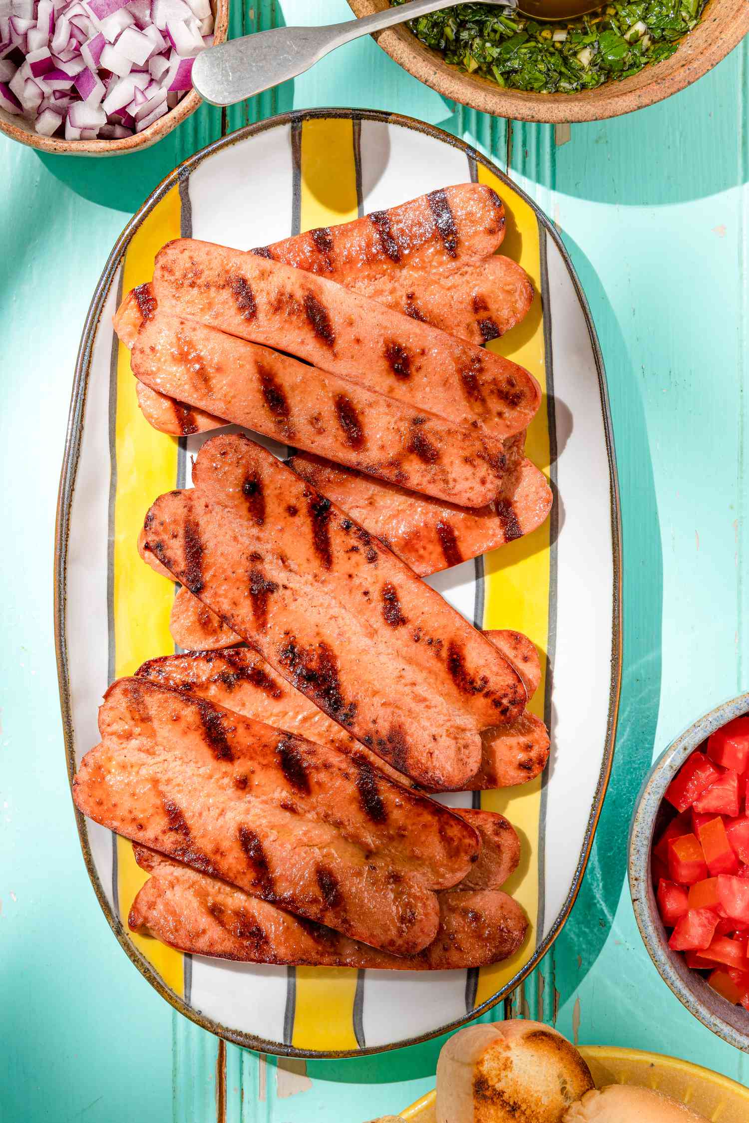 butterflied hot dogs on a platter
