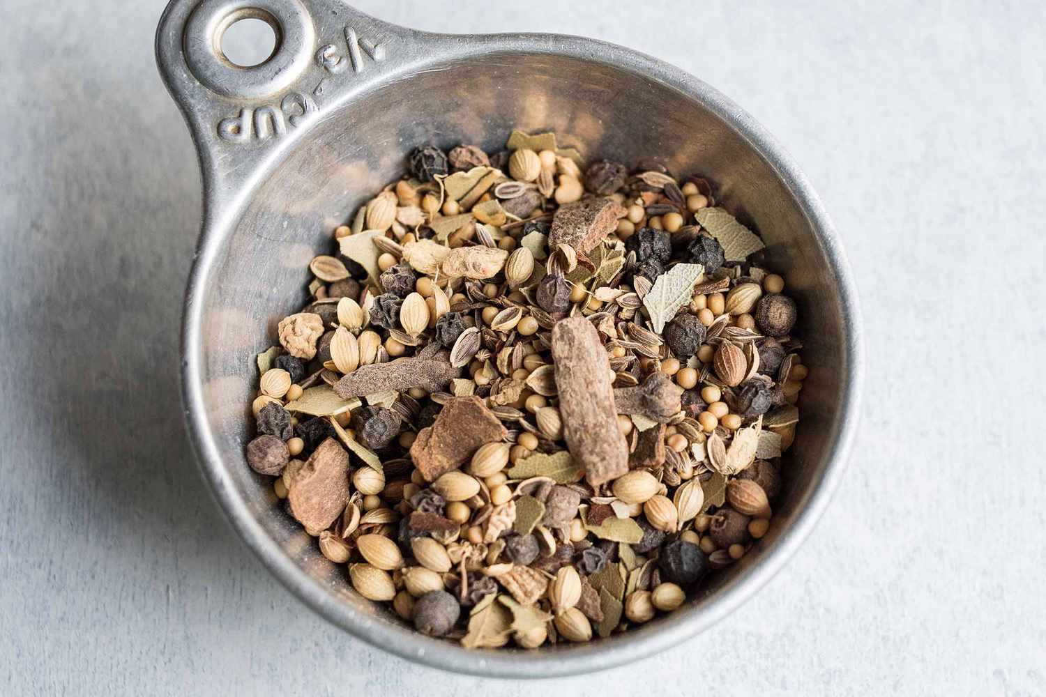 Basic Pickling Spice Blend in a measuring cup