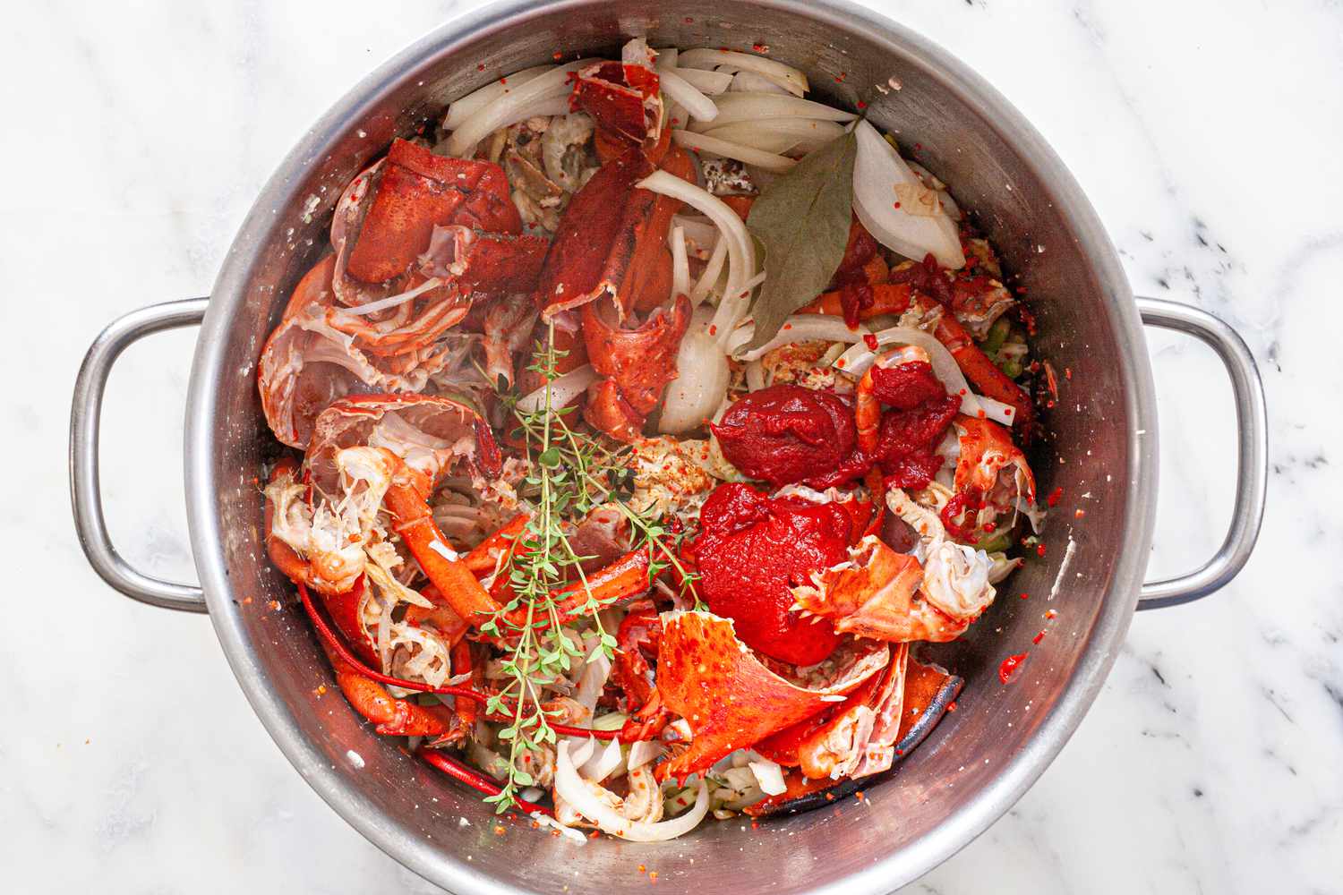 Thyme, Onions, Tomato Paste, and Celery Added to Pot with Lobster Shells