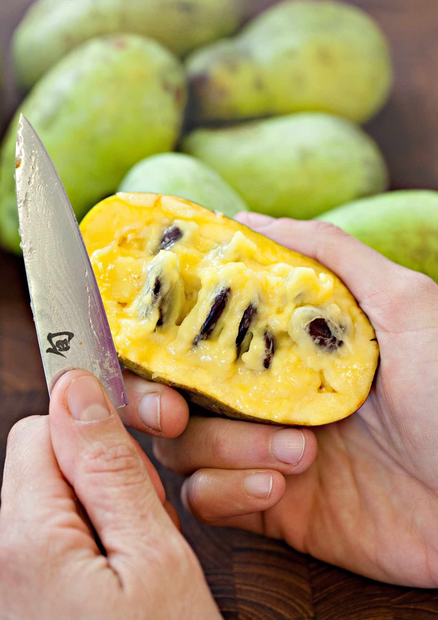 Pawpaw Cut in Half, Showing a Custardy Pulp with Seeds